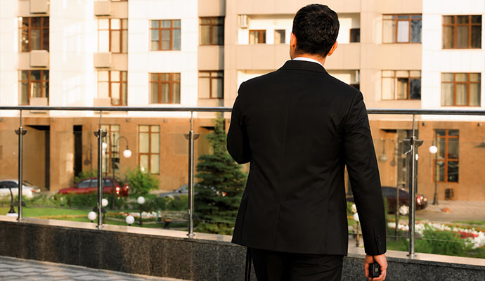 Security guard on an apartment balcony