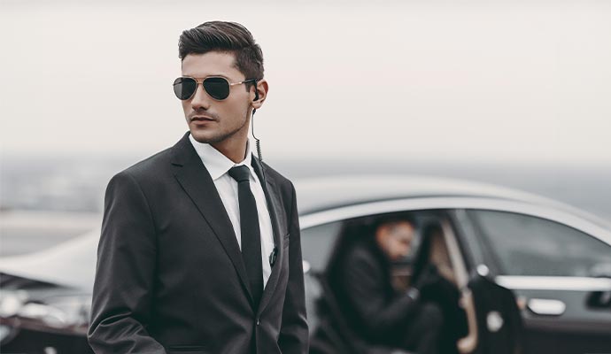 Security guard with earpiece and sunglasses