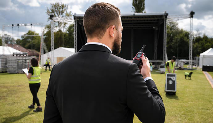 Security guard with walkie-talkie at an event