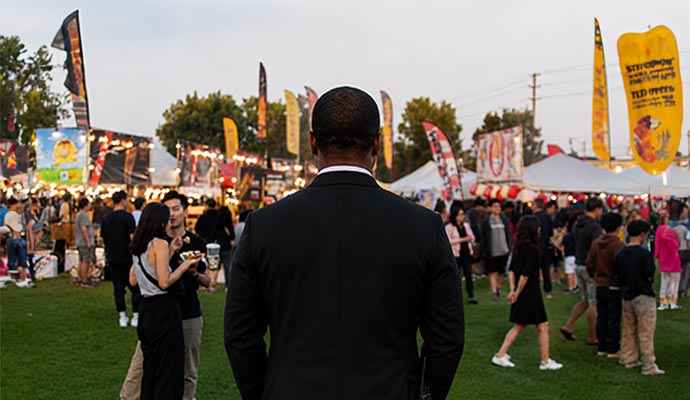 Security officer monitoring a crowded outdoor event