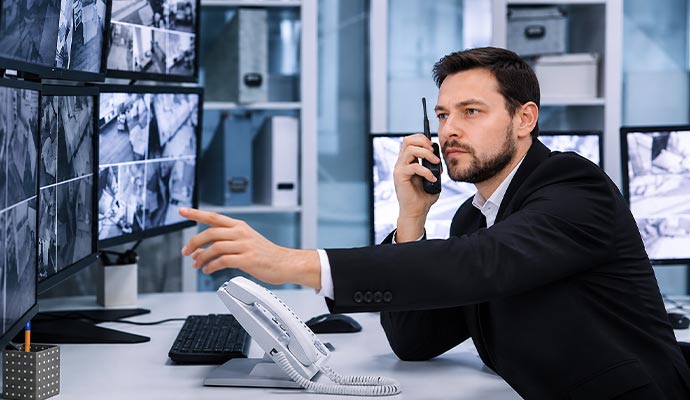 Security operator monitoring camera feeds