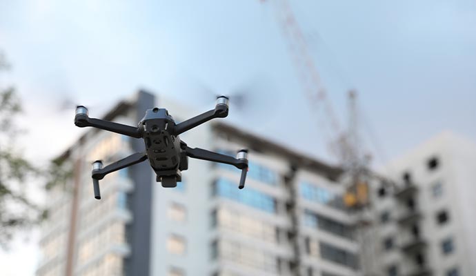 Drone flying near urban building for surveillance