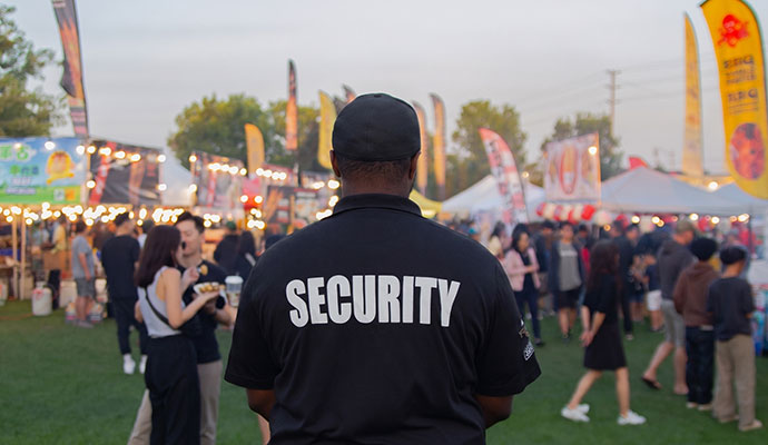 Event security guard monitoring crowd at festival