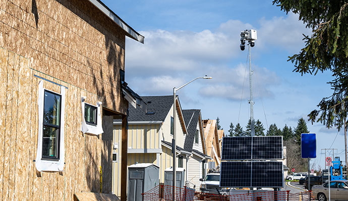 Solar powered surveillance system at residential construction site